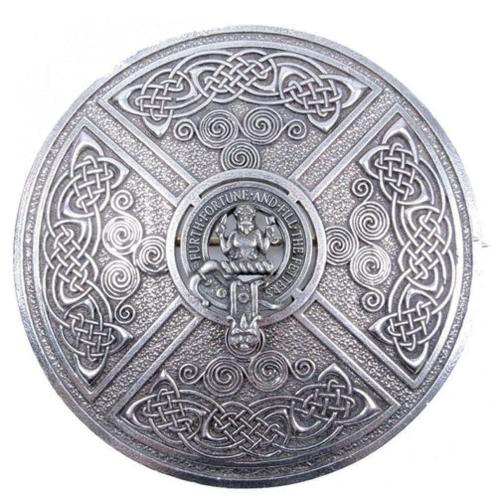 Round silver Scottish clan brooch with Celtic knotwork and a central crest set within Saltire-style diagonal sections.