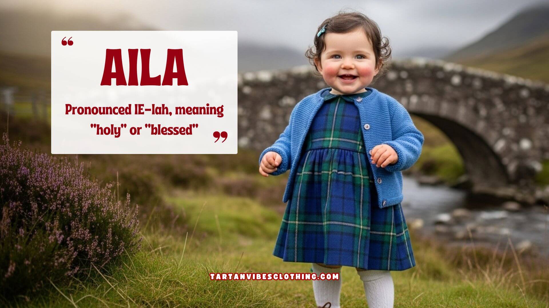 A smiling toddler in a blue tartan dress and cardigan stands near a stone bridge in the Scottish Highlands.