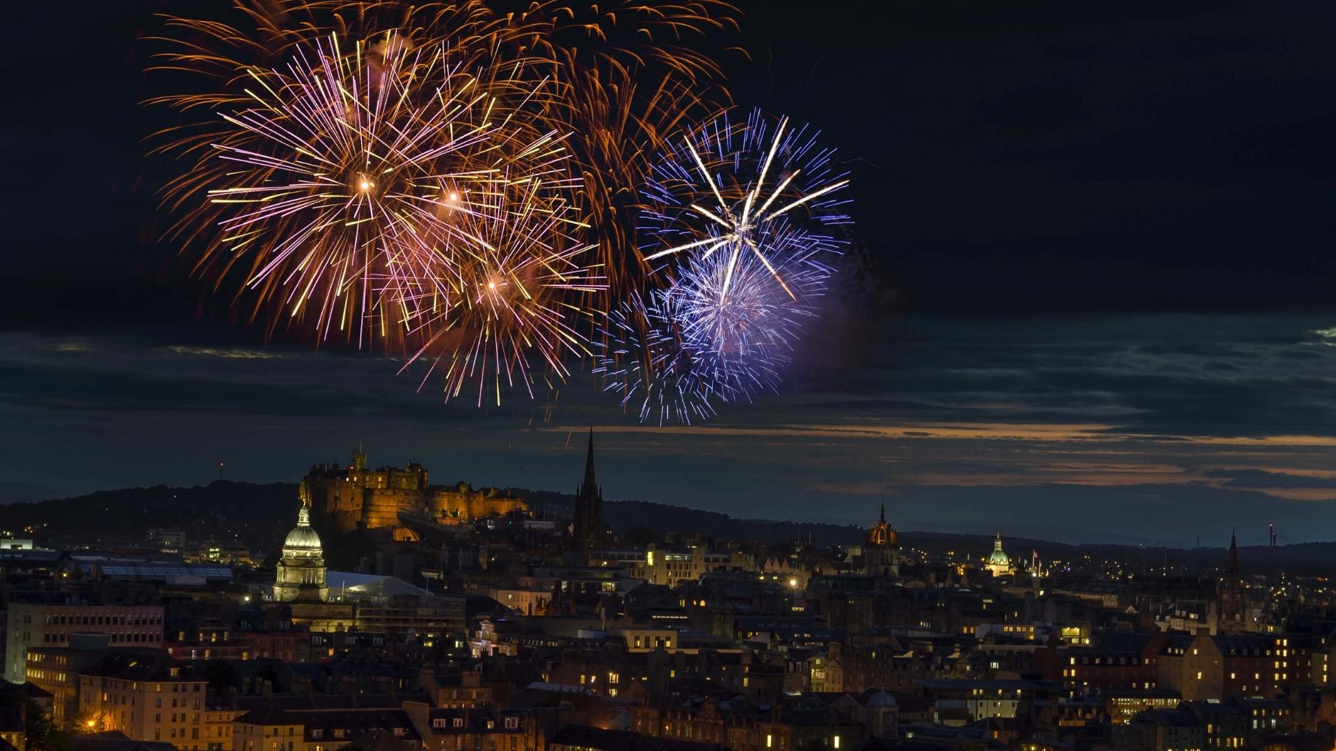 Fireworks over Edinburgh at night, celebrating Hogmanay and Scotland’s traditional New Year rituals.