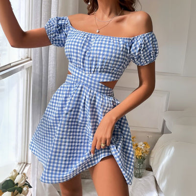 Woman wearing a blue Gingham dress with a classic checkered pattern