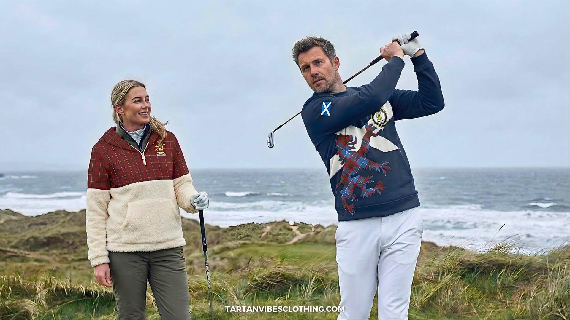Golfers wearing mid-layer sweatshirts and fleece hoodies on a windy Scottish links course