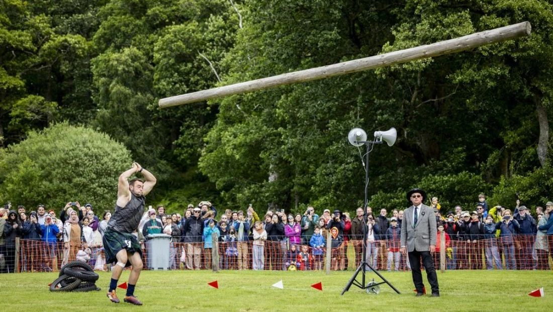 Luss Highland Games caber toss competition in Scotland