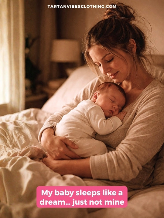 New mom joke: tired mother holding sleeping baby in bed