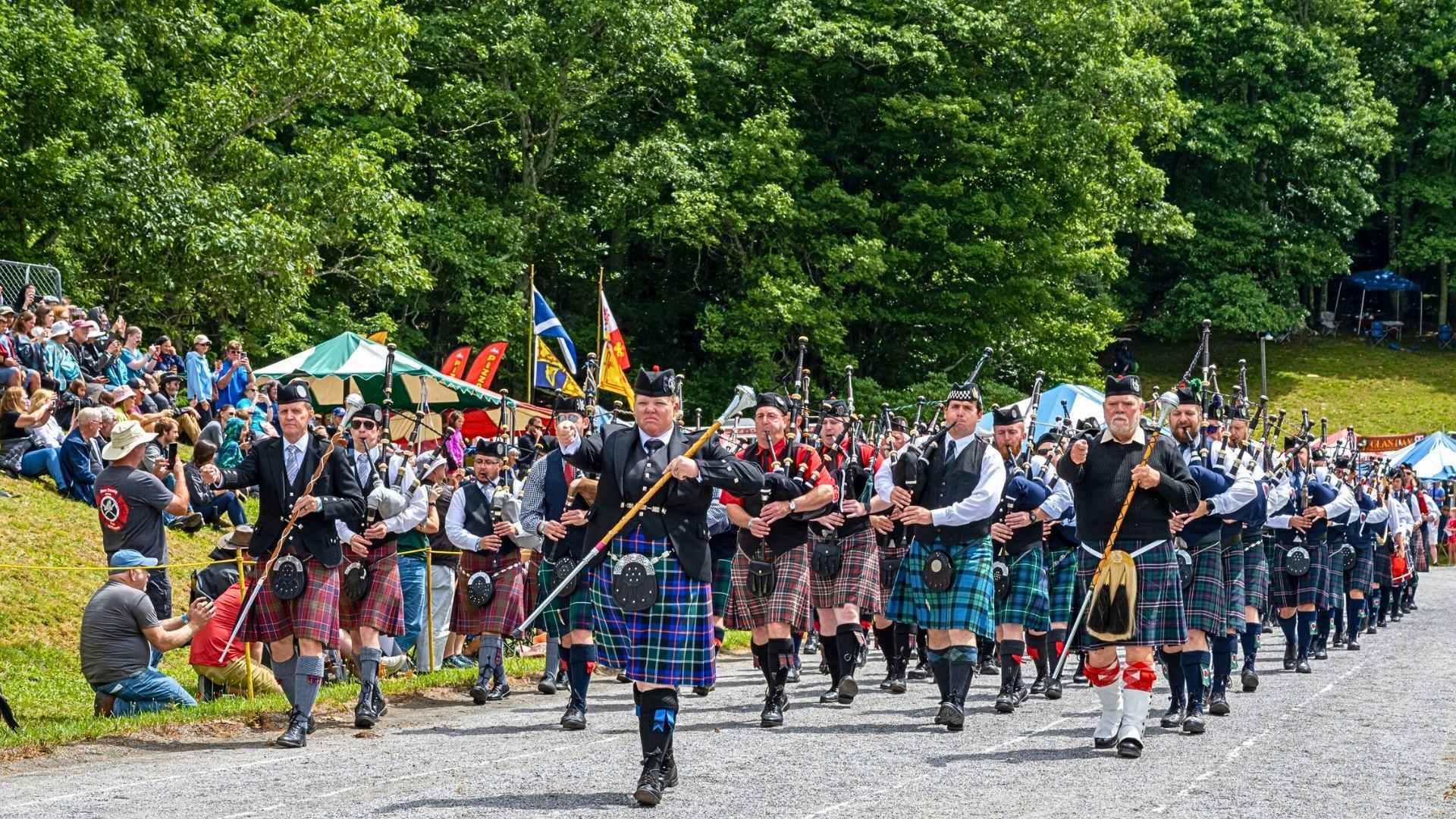 Pipe bands march in unison, filling the air with stirring Scottish music at the Grandfather Mountain Highland Games.
