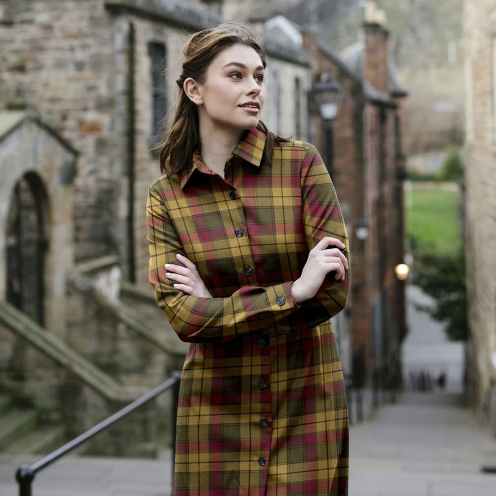Woman wearing a tartan shirt dress in a classic Scottish street setting