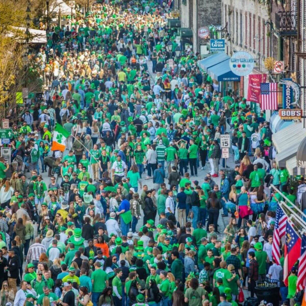 Large St. Patrick’s Day street celebration with crowd dressed in green