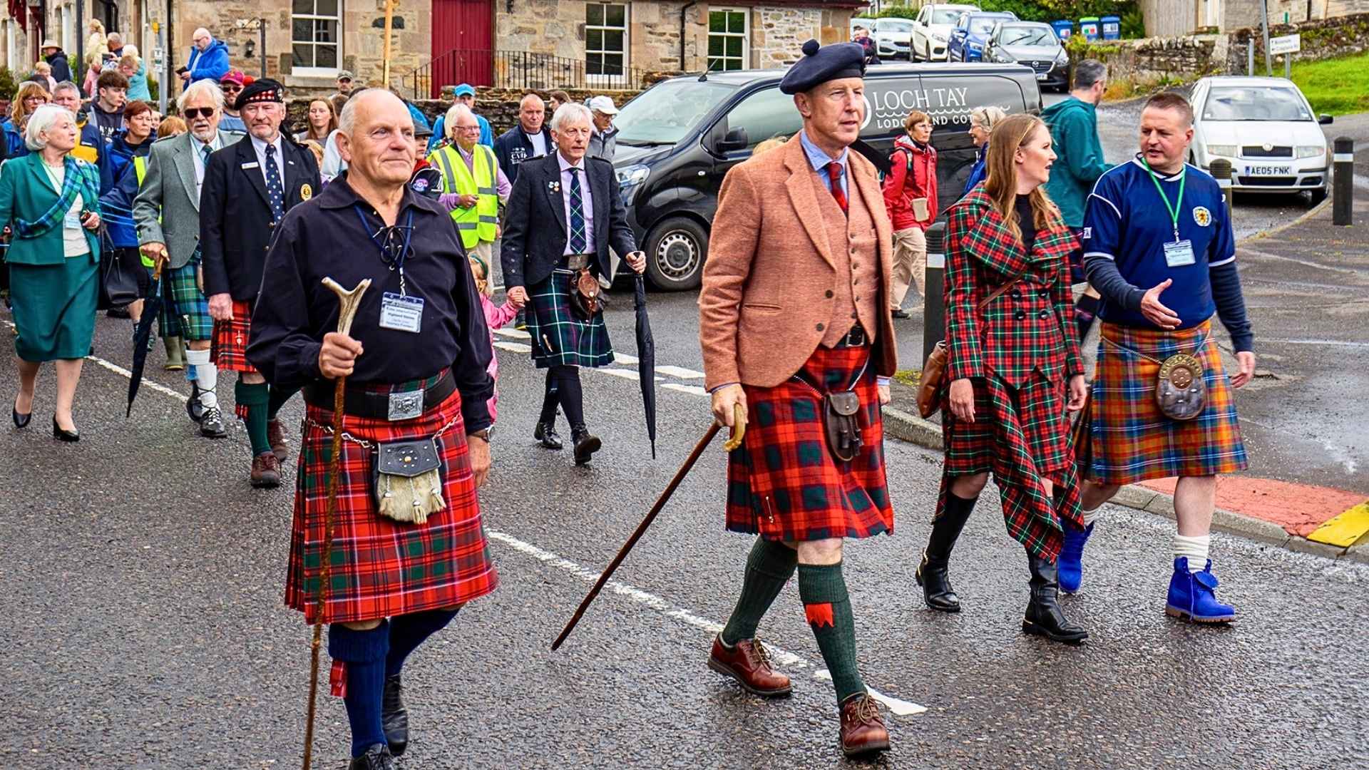 The Chief and members of Clan MacNab proudly march in traditional Highland dress during the Killin Highland Games 2024.